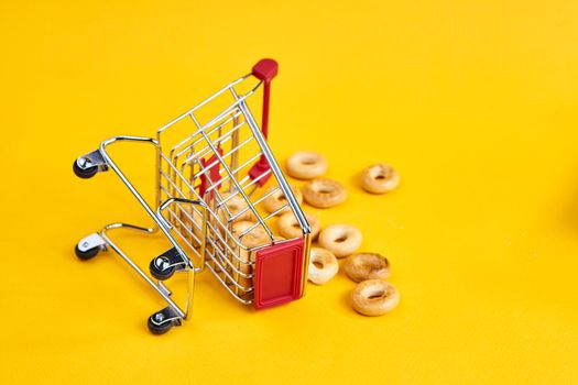carts with groceries shopping supermarket store yellow background