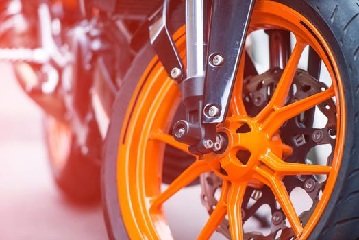 Front orange wheel of sport bike