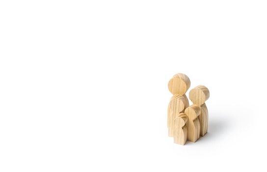 Wooden figurines of the family on a white background. Family values and health. Adoption and custody of children. Social support, demography, sociology. Upbringing and education. Together concept