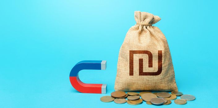 Israeli shekel money bag and red blue magnet. Tax collection. Raising funds and investments in business projects and startups. Money laundering. Accumulation and attraction of capital.