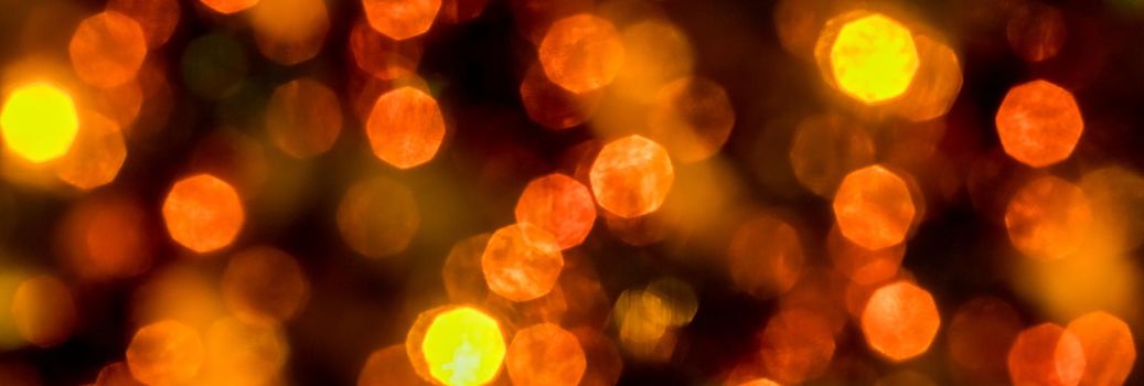yellow and orange holiday bokeh. Abstract Christmas background.Christmas and New Year holidays background. Blurred Bokeh.Web banner