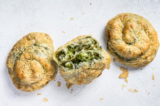 Spinach and feta cheese Twist greek Pie puff. White background. Top view
