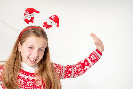 Portrait of excited funny funky schoolchild dancing in christmas costume with headband isolated on white background.Ready For Christmas party.Merry Christmas presents shopping sale concept.