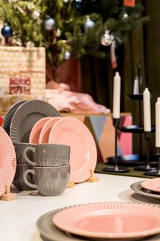 New gray, pink table setting . modern style. Serving for store catalog. Hot drinks tea or coffee. Stylish elegant ceramic dishware on shop shelves,Various kitchen utensils.Tender, pastel color