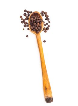 black pepper in a spoon