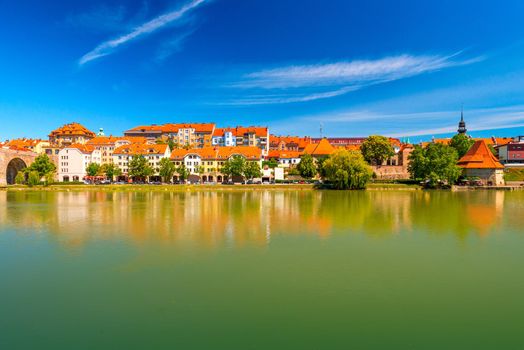 Cityscape of Maribor reflected in the water, Slovenia