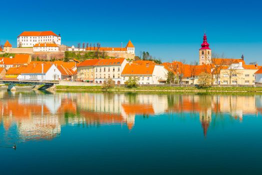 Beautiful cityscape of Ptuj reflected in the water, Slovenia