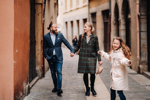 A beautiful family with strolls through the old city of Lyon in France.Family trip to the old cities of France