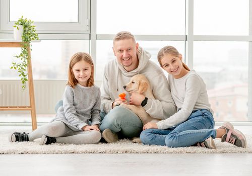 Happy family and puppy