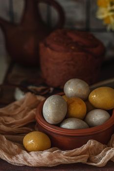 Natural dye for Easter eggs - turmeric on vintage wooden background