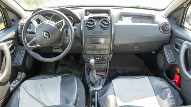Renault Duster salon. Interior design, dashboard, speedometer, tachometer and steering wheel inside the car. The car is produced by the French company Renault. Ukraine, Kiev - June 15, 2021.