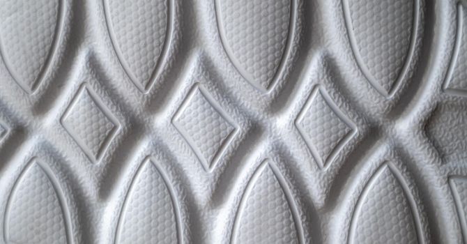 The outsole of new white sneakers. Rubber sole for men's shoes. Sole for sports and walking shoes. The texture of the material of sports shoes