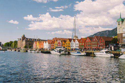 Bergen, Norway. View of historical buildings in Bryggen. Hanseatic wharf in Bergen, Norway July 28, 2019. UNESCO. Famous Bryggen street with wooden colored houses in Bergen Akerbrygge distric