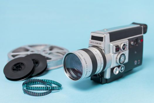 film reels film strips vintage camcorder blue background