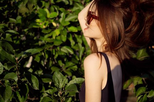 glamorous woman wearing sunglasses summer posing nature tropics