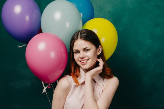 cheerful woman with colorful balloons birthday fun. High quality photo