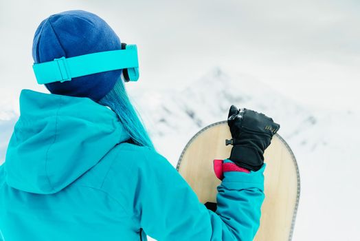 Snowboarder woman in winter.