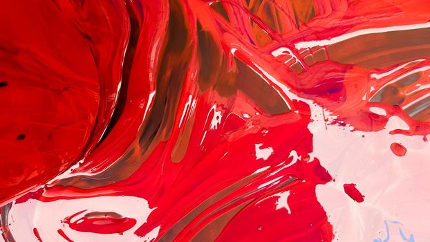 Abstract background of spilled red paint with buckets on a black backdrop. Red paint is pouring on a black background. Use it for an artist or creative concept. paints spilled red colored background