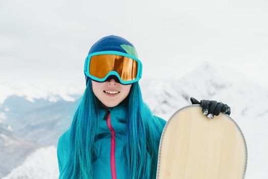 Snowboarder girl in winter.