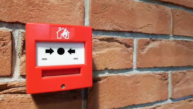 fire alarm system box installed on wall in building.