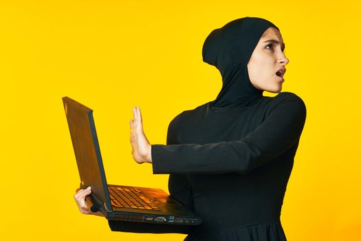 pretty woman arab clothing laptop technology internet ethnicity model