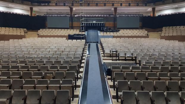 Ukraine, Kiev - June 9, 2020. Interior of an empty concert hall with beige seats and a balcony