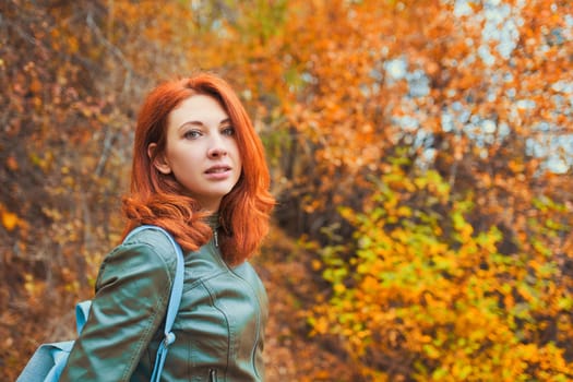 Young woman with autumn tree.