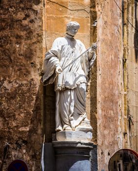 statue on a street of Valletta