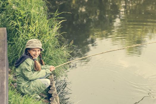 little fisher on a river bank