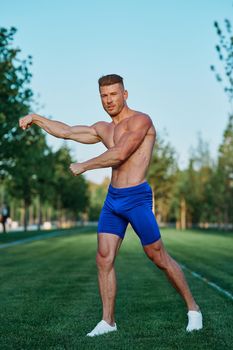 man doing exercises in the park inflated body