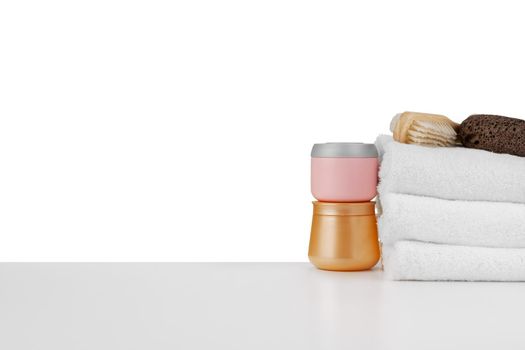 Spa still life with stacked of stone and towel isolated on white