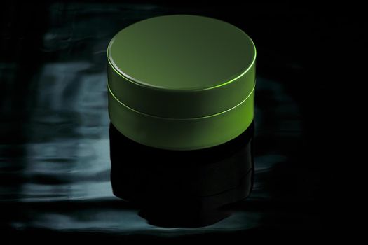 Small green jar in water with reflection on a dark background. Mockup for advertising cream, lation, moisturizing milk