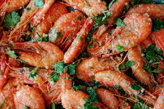 Fresh boiled prawns with coriander. A delicious dish of seafood.