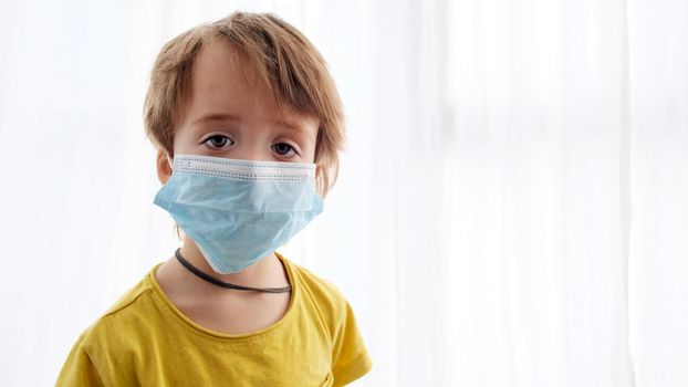 Portrait of a child in a medical protective mask
