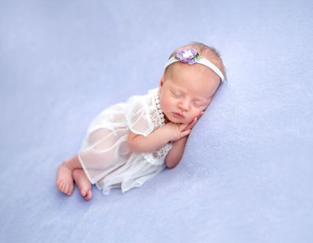 Cute newborn in lace dress