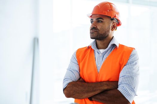 Portrait of young construction engineer wearing hardhat