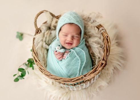 Funny newborn smiling in dream