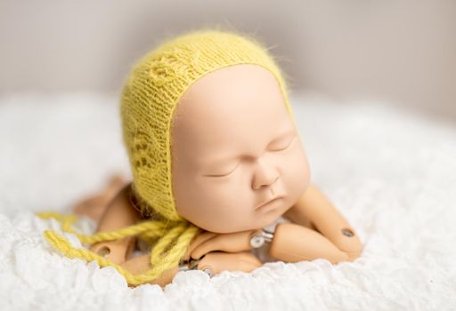 Plastic figure of newborn for photographing