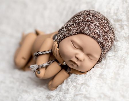 Mannequin of newborn for photo posing