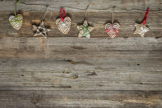 christmas handmade decorations on old wooden background