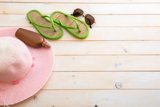 beach accessories on a wooden background