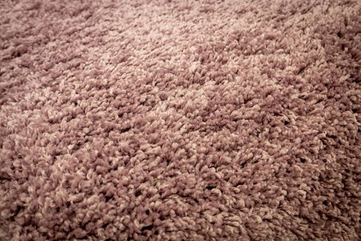 Close up view of carpet. Wall-to-wall carpeting background.