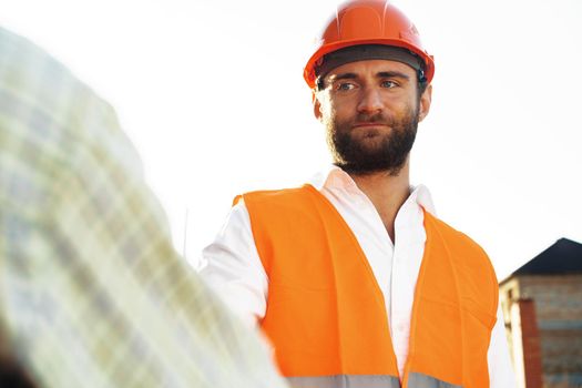 Portrait of young construction engineer wearing hardhat