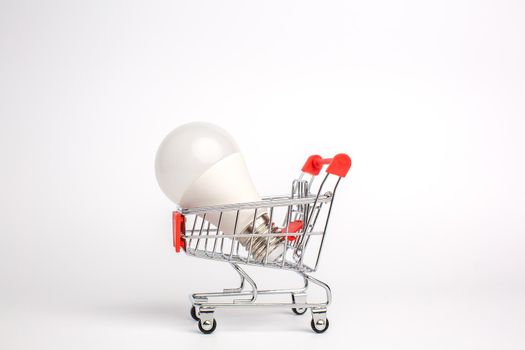 LED light bulbs on a cart, Isolated on white background. The concept of selling and buying business ideas