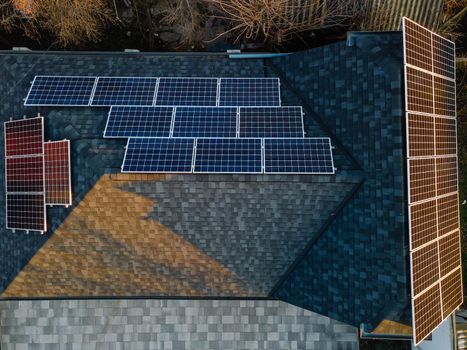 Aerial view of solar photovoltaic panels on a house roof