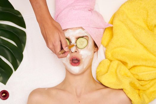 cheerful woman spa treatments cosmetics beauty saloon light background