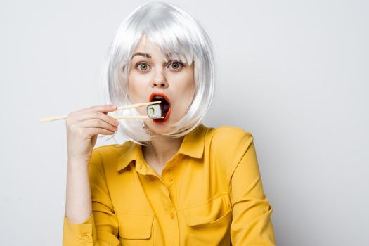 cheerful woman in white wig japanese food glamor
