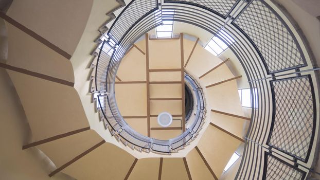 Upside view of a spiral staircase. Europe