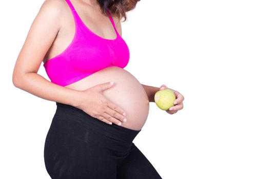 Beautiful pregnant woman with green apple isolated on white 