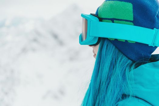 Woman snowboarder in sunglasses